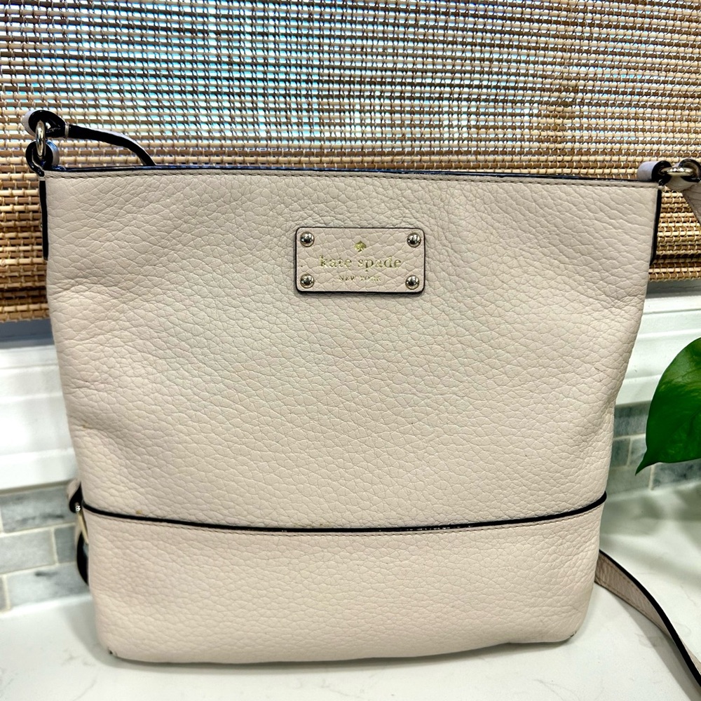 Kate Spade Pebbled Leather Bay Street Cora Slim Crossbody Bag in “Tusk”